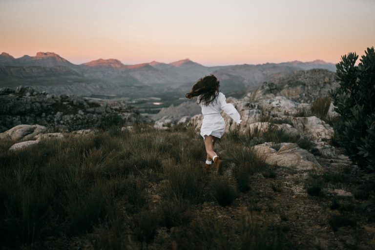 Person walking briskly outdoors, symbolizing movement as a release from anxiety