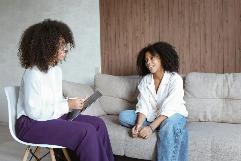 Therapist listening to patient talk about her sleeping difficulties.
