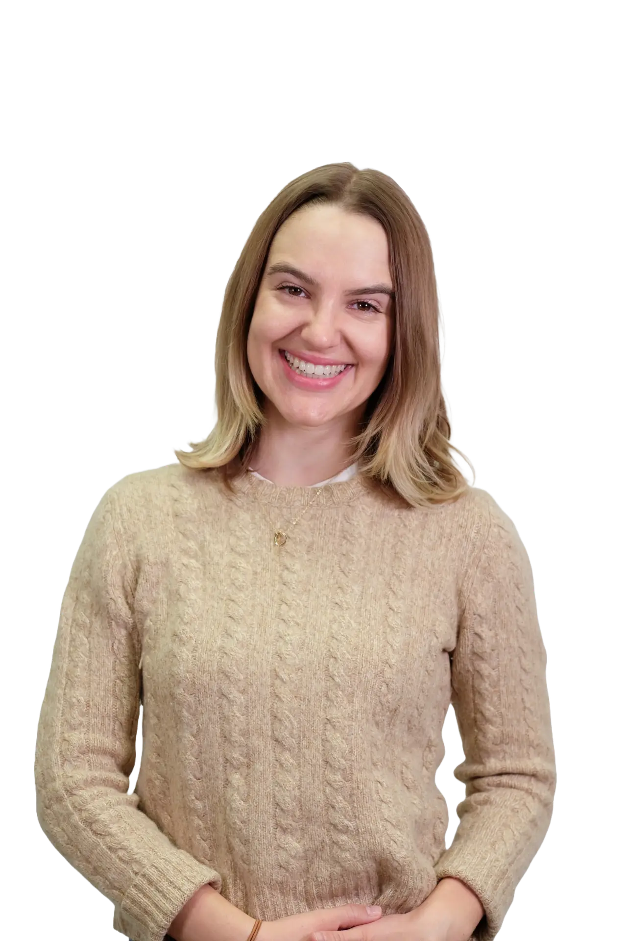 Headshot of Annie Tuma smiling. She's wearing a beige sweater.